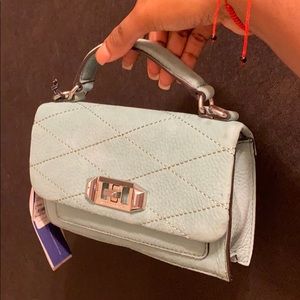 Dusty green crossbody Rebecca Minkoff bag.